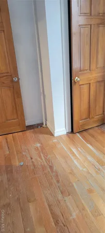 a white toilet sitting next to a shower
