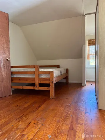 a view of room with wooden floor and air conditioner