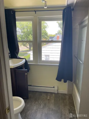 a bathroom with a toilet a sink and a vanity