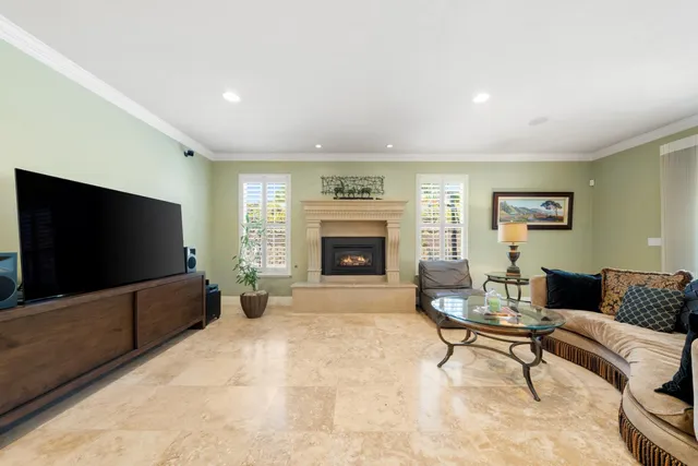 a kitchen with stainless steel appliances granite countertop a refrigerator and a stove