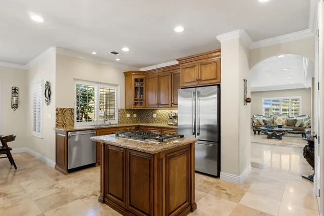 a bathroom with a granite countertop sink mirror toilet and shower