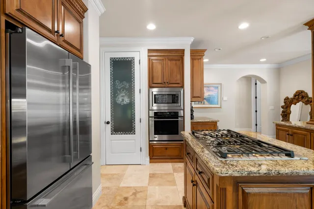 a spacious bedroom with a bed and a couch