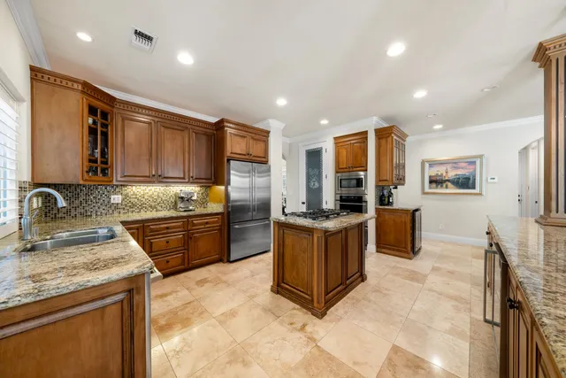 a spacious bedroom with a bed and a dresser