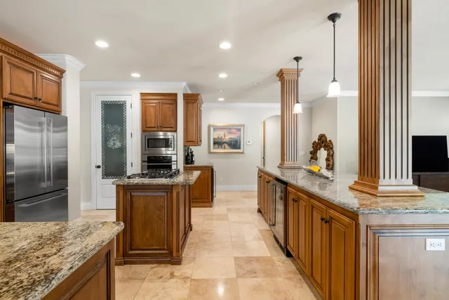 a spacious bedroom with a bed and a fireplace