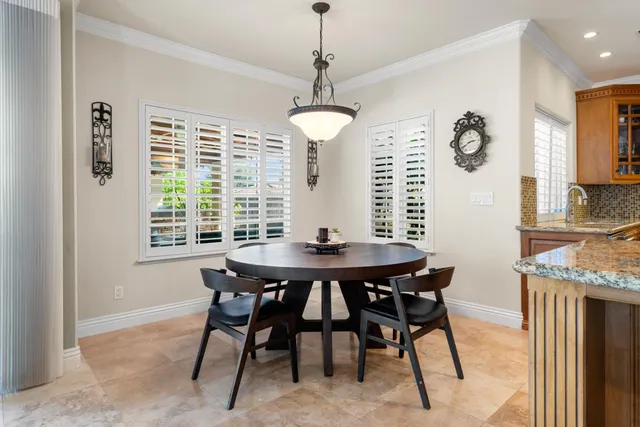 a bathroom with a granite countertop sink mirror and shower