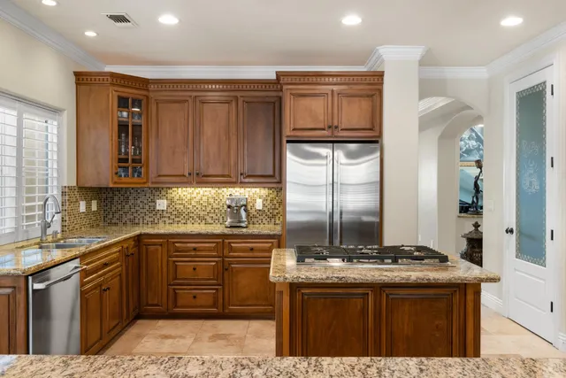 a bathroom with a tub sink shower and mirror