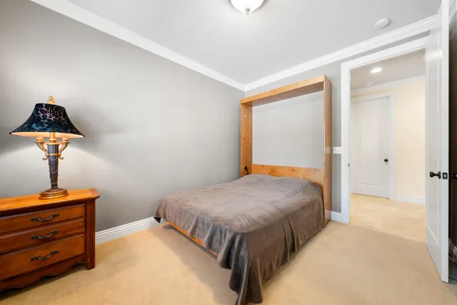 a living room with furniture a flat screen tv and a dresser