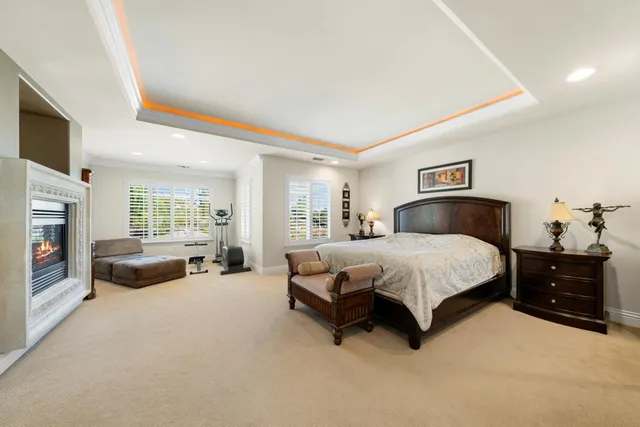 a view of a livingroom with workspace and a window