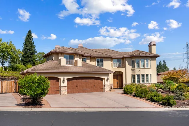 a front view of a house with yard