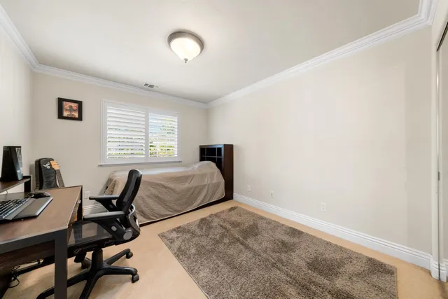 a view of a swimming pool with a table and chairs