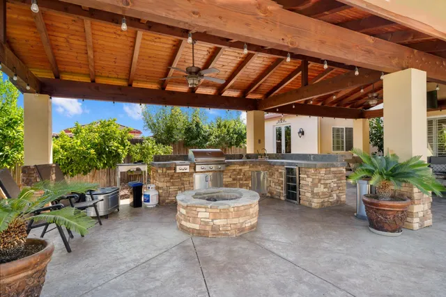 an aerial view of a residential building with an outdoor space