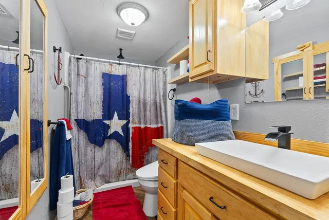 a bedroom with furniture and a bed