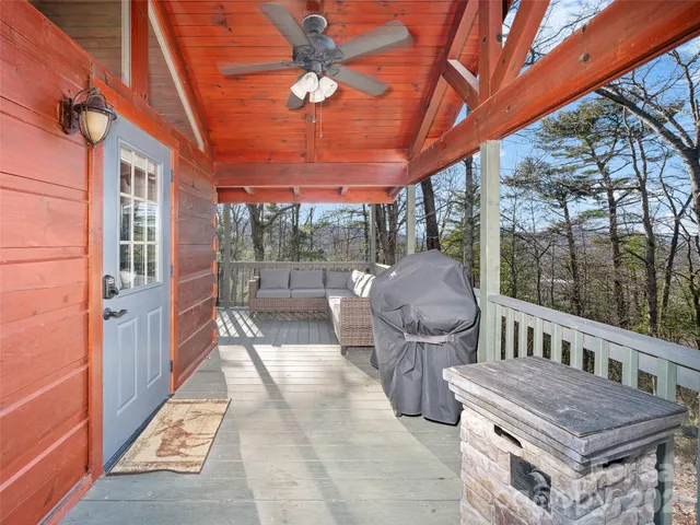 a view of a patio with a table and chairs