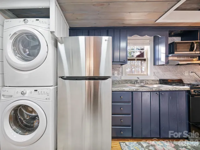 a view of a kitchen with washer and dryer