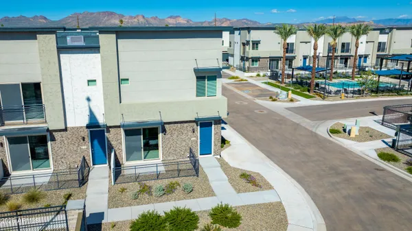 a front view of a house with outdoor seating