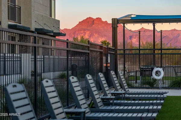 a view of a balcony with chairs