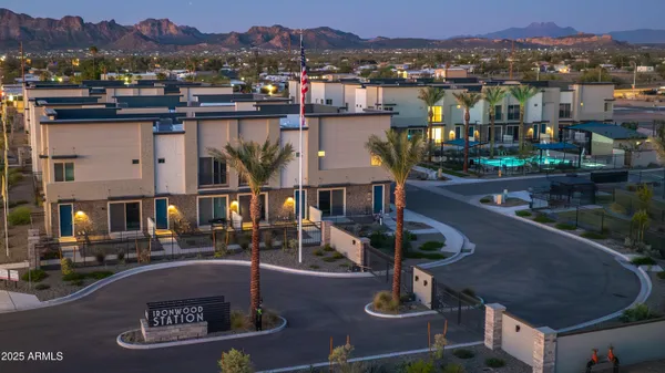 a view of a lake with a building and trees in the background