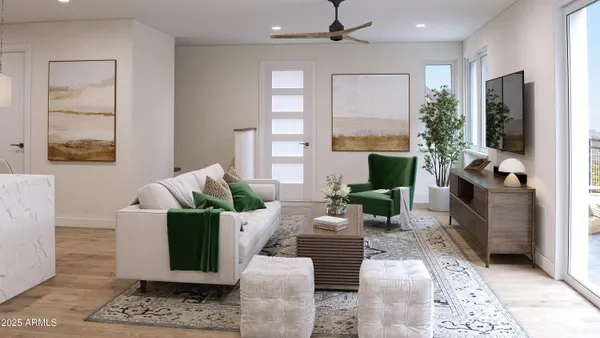 a living room with furniture large window and a fireplace