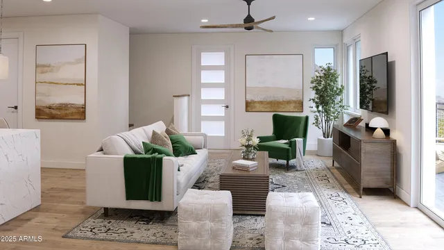 a living room with furniture large window and a fireplace