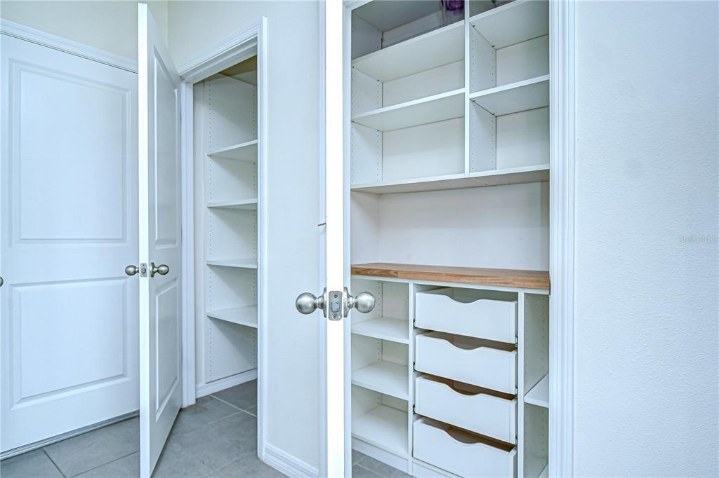 1382 Crescent Hoop Way Wesley Chapel, FL 33543 - Photo 11 of 27 a view of an empty walk in closet