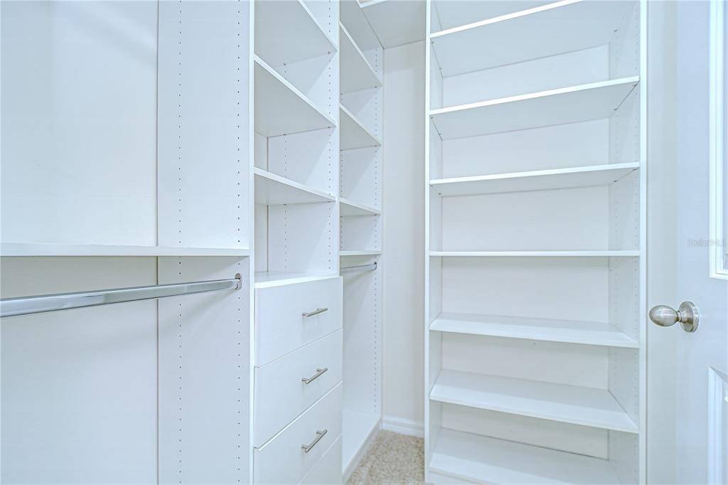1382 Crescent Hoop Way Wesley Chapel, FL 33543 - Photo 20 of 27 a view of an empty walk in closet