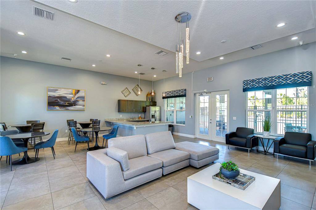 1382 Crescent Hoop Way Wesley Chapel, FL 33543 - Photo 27 of 27 a living room with furniture and a large window