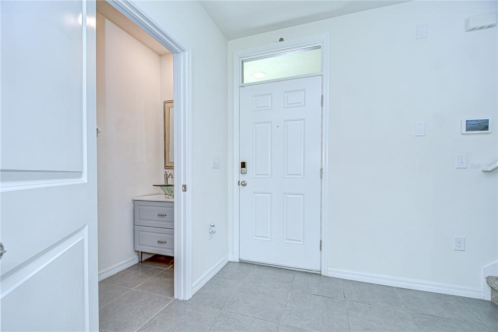 1382 Crescent Hoop Way Wesley Chapel, FL 33543 - Photo 3 of 27 a view of room with closet and mirror