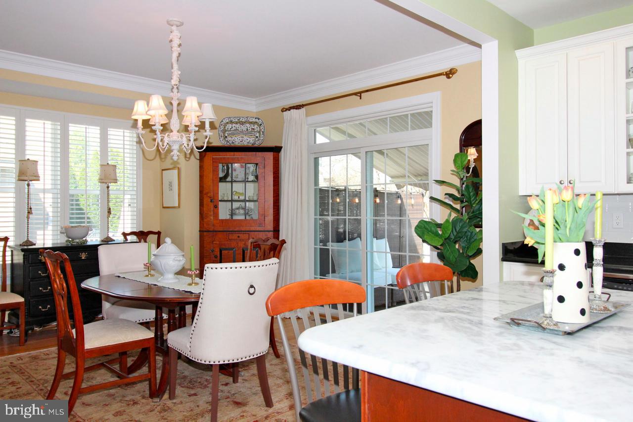 117 West 5th Street Media, PA 19063 - Photo 12 of 54 a dining room with furniture a large window and a chandelier