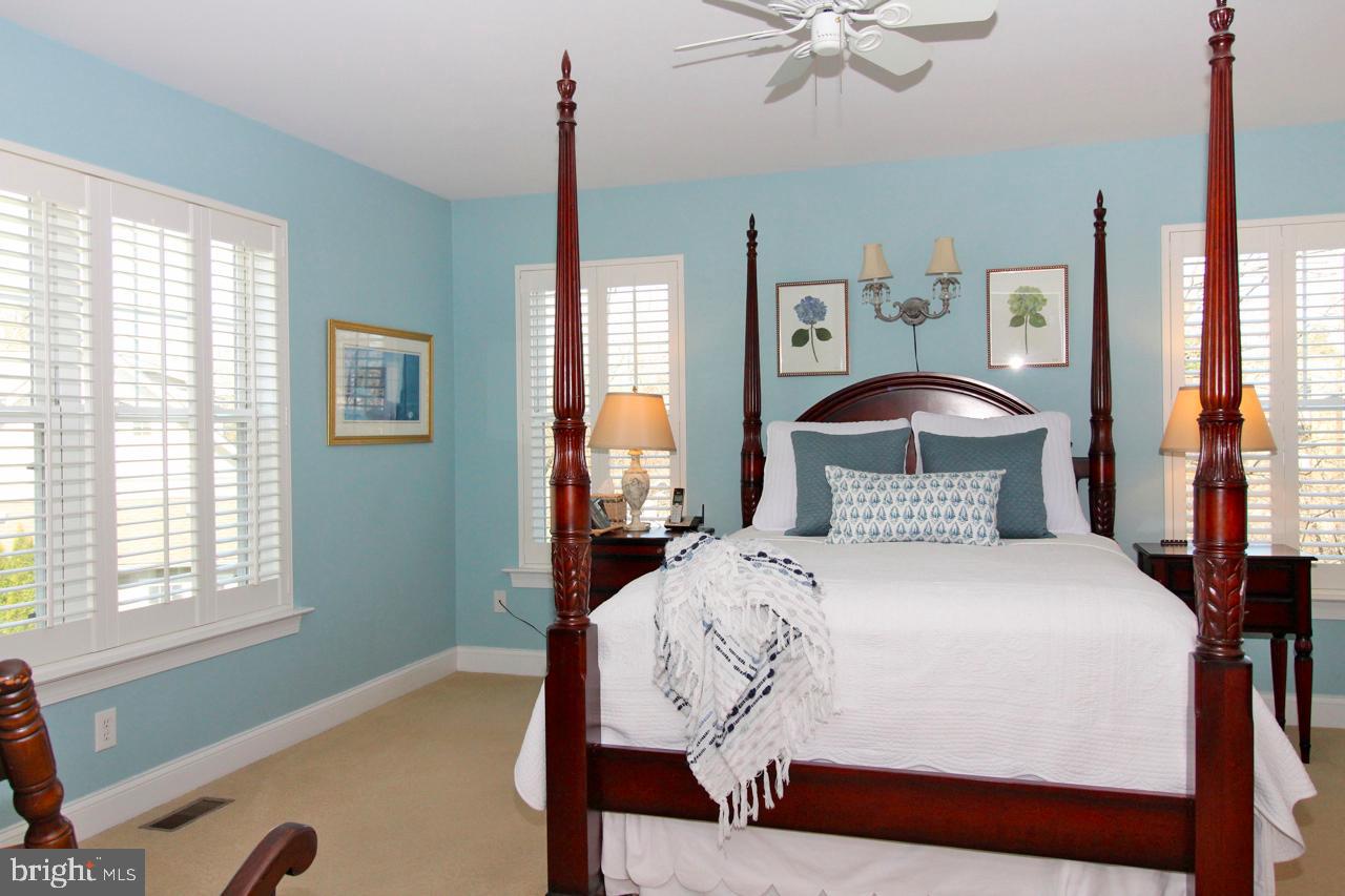 117 West 5th Street Media, PA 19063 - Photo 26 of 54 a bedroom with a bed and a chandelier