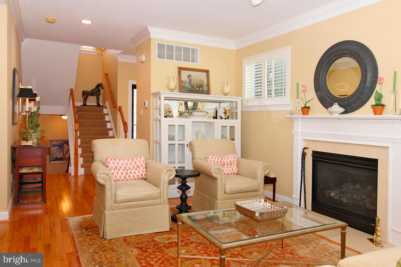 117 West 5th Street Media, PA 19063 - Photo 7 of 54 a living room with furniture a rug a fireplace and a large window