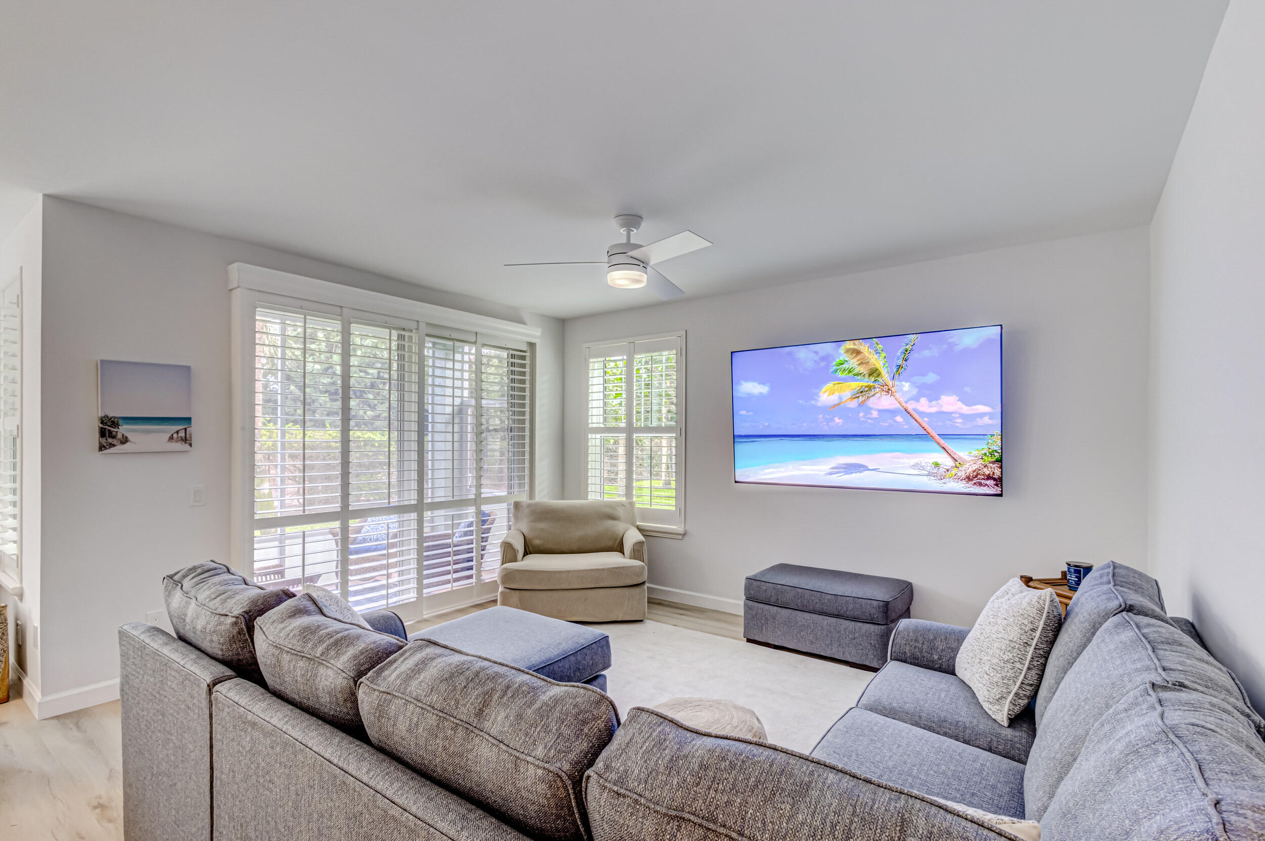 207 Mainsail Circle Jupiter, FL 33477 - Photo 19 of 56 a living room with furniture and a flat screen tv