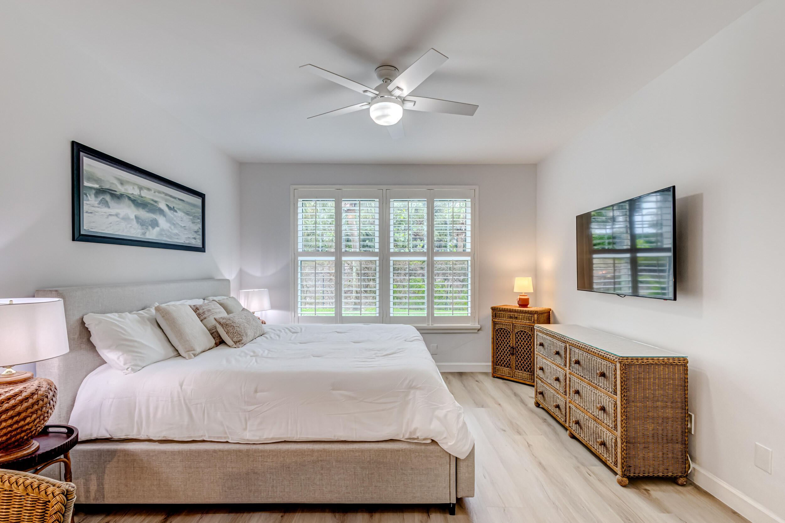207 Mainsail Circle Jupiter, FL 33477 - Photo 24 of 56 a bedroom with a bed a dresser next to a window