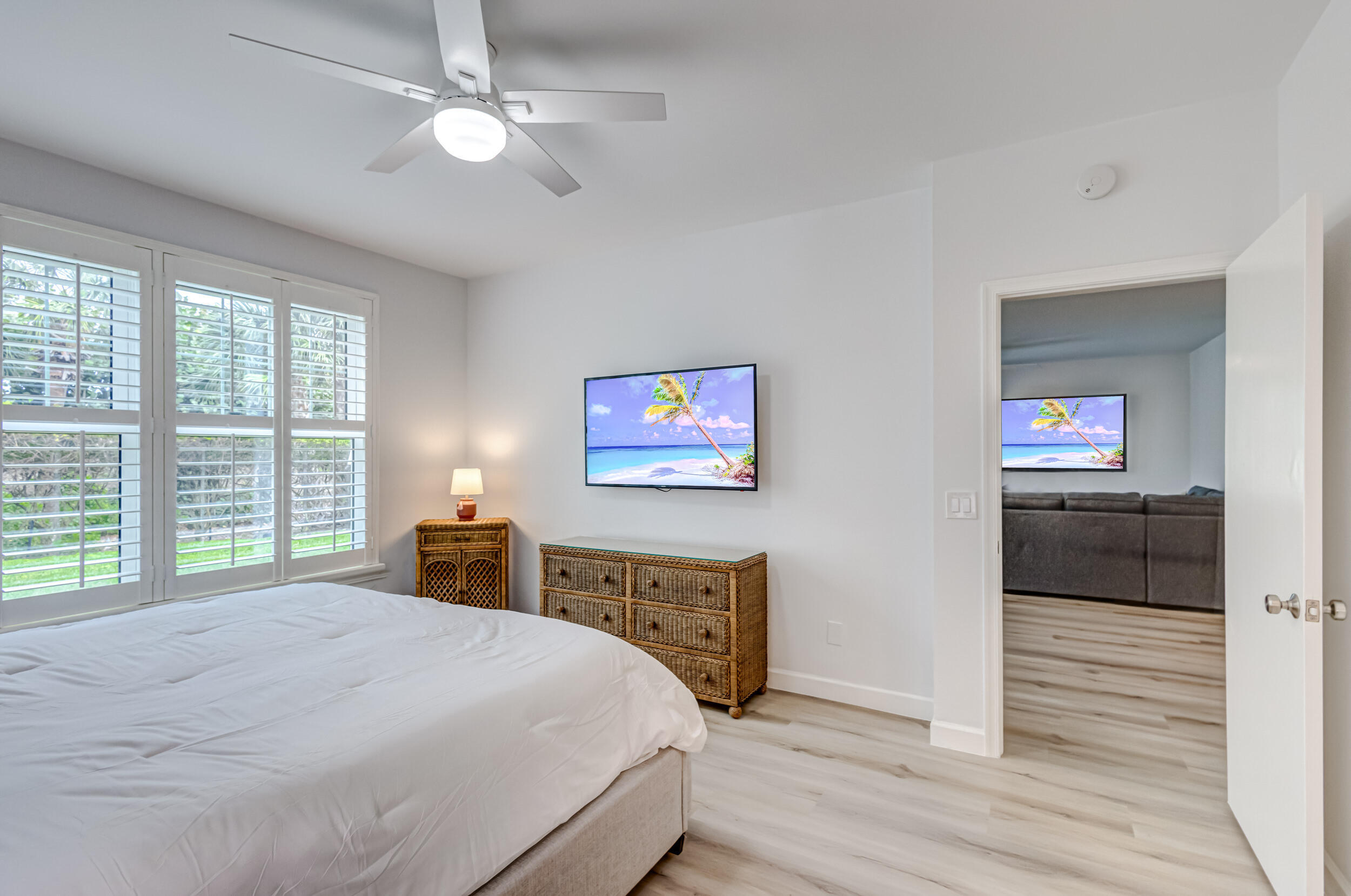 207 Mainsail Circle Jupiter, FL 33477 - Photo 25 of 56 a bedroom with a bed and a flat screen tv