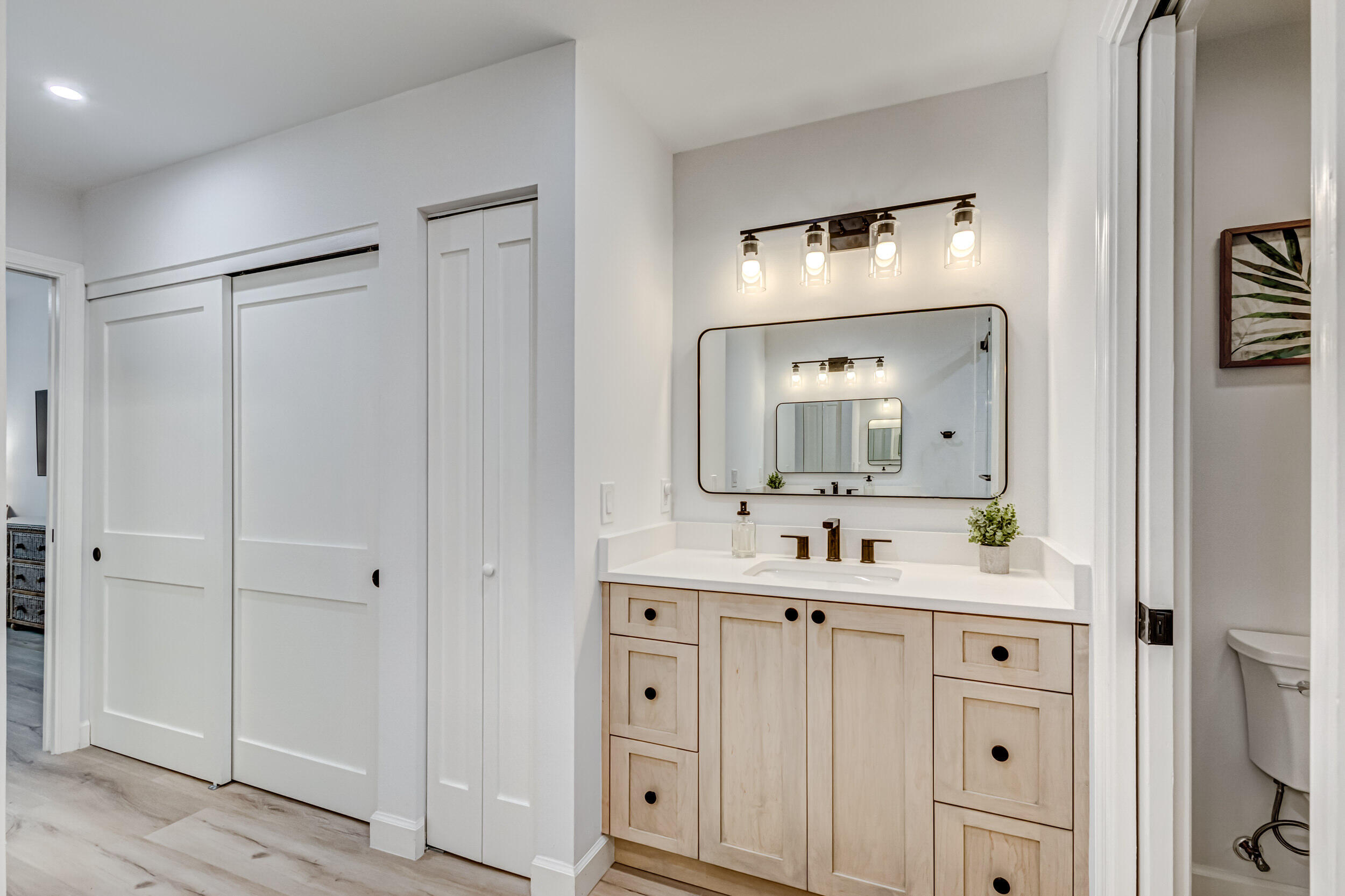 207 Mainsail Circle Jupiter, FL 33477 - Photo 28 of 56 a bathroom with a double vanity sink and mirror