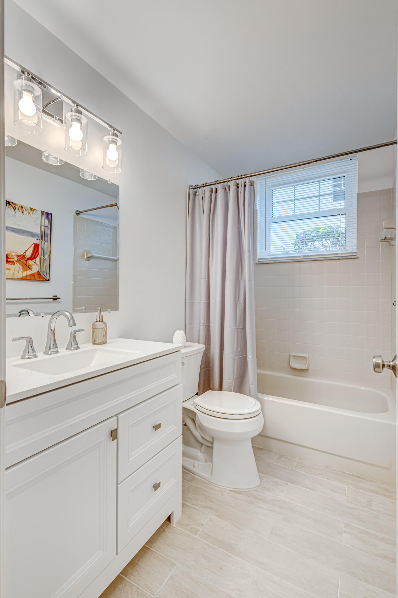 207 Mainsail Circle Jupiter, FL 33477 - Photo 33 of 56 a bathroom with a toilet a sink a tub and a mirror