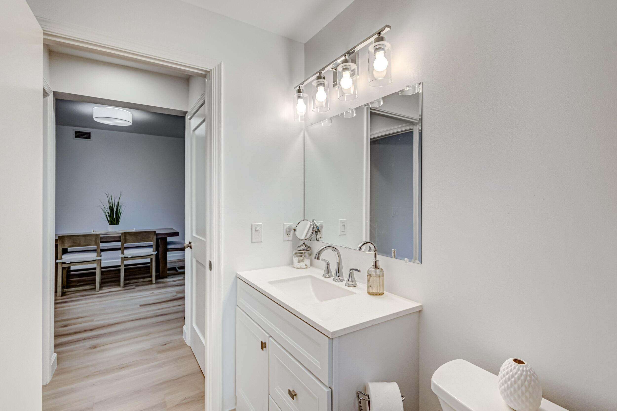 207 Mainsail Circle Jupiter, FL 33477 - Photo 34 of 56 a en suite bathroom with a toilet sink and mirror