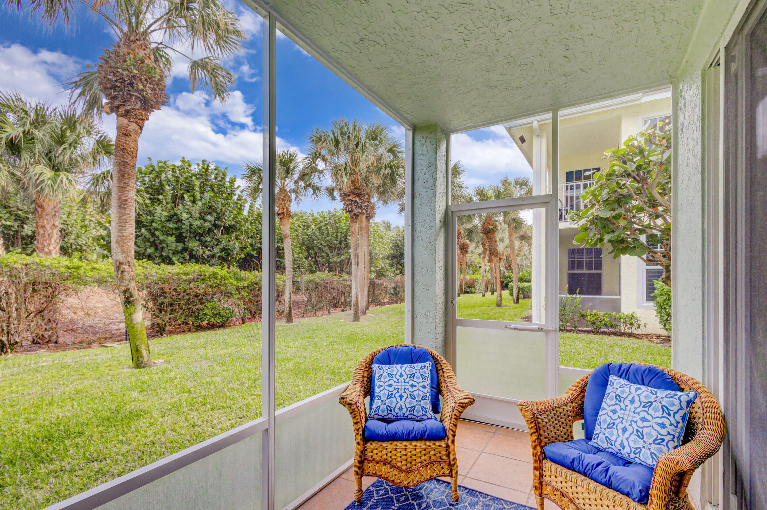 207 Mainsail Circle Jupiter, FL 33477 - Photo 35 of 56 a blue chair sitting in front of a house