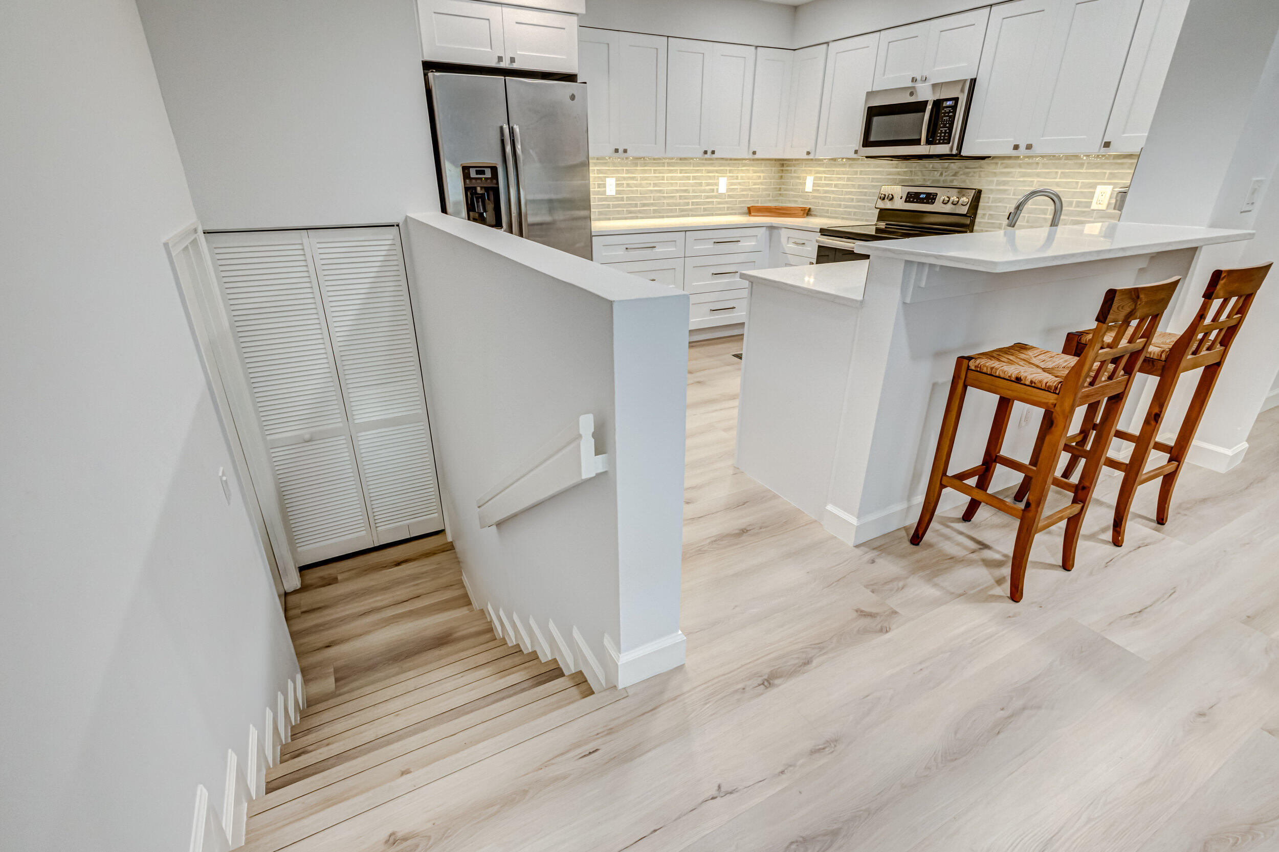 207 Mainsail Circle Jupiter, FL 33477 - Photo 9 of 56 a kitchen with granite countertop cabinets and refrigerator