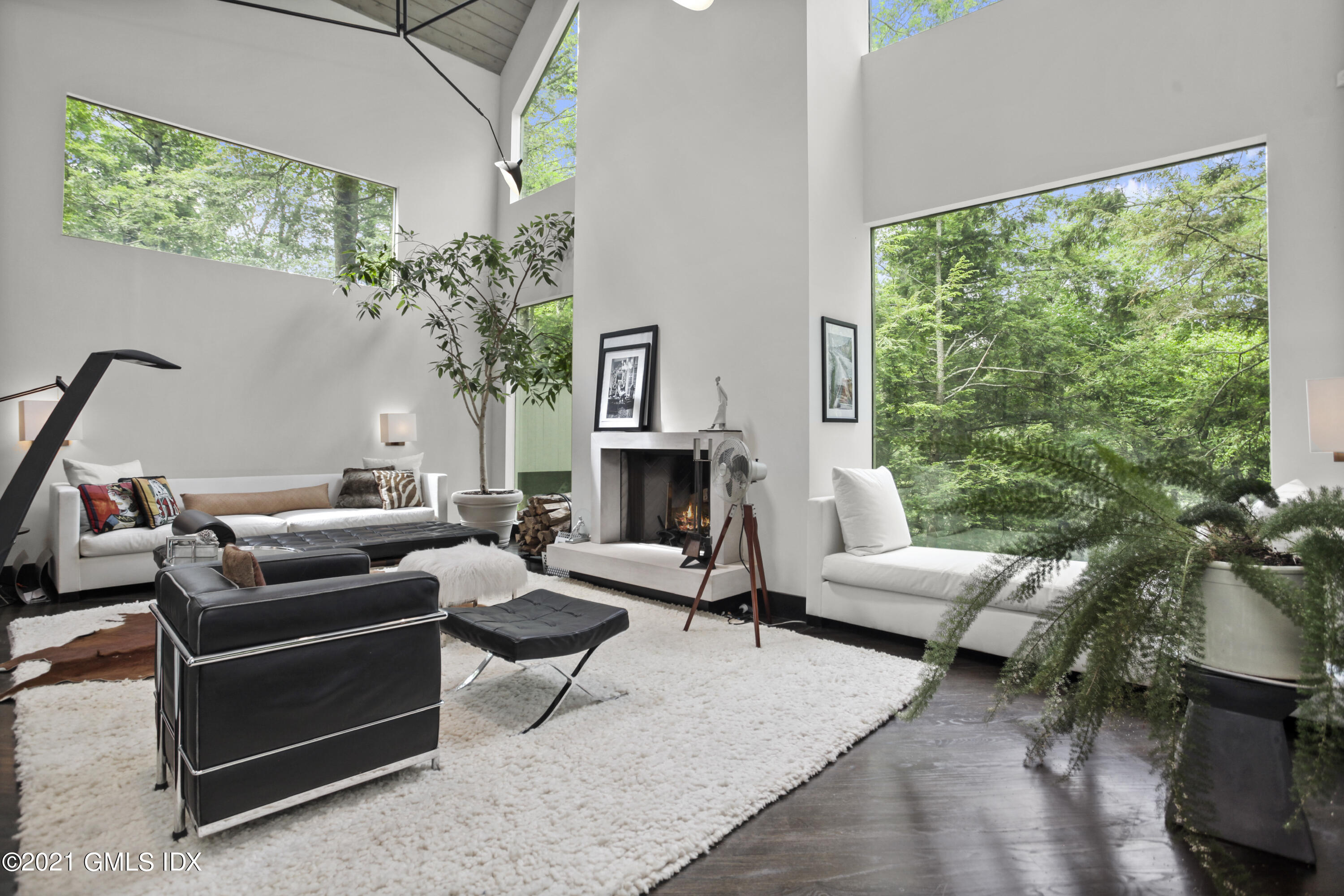 49 Mill Brook Road, Unit WEST Stamford, CT 06902 - Photo 1 of 37 a living room with furniture and a fireplace