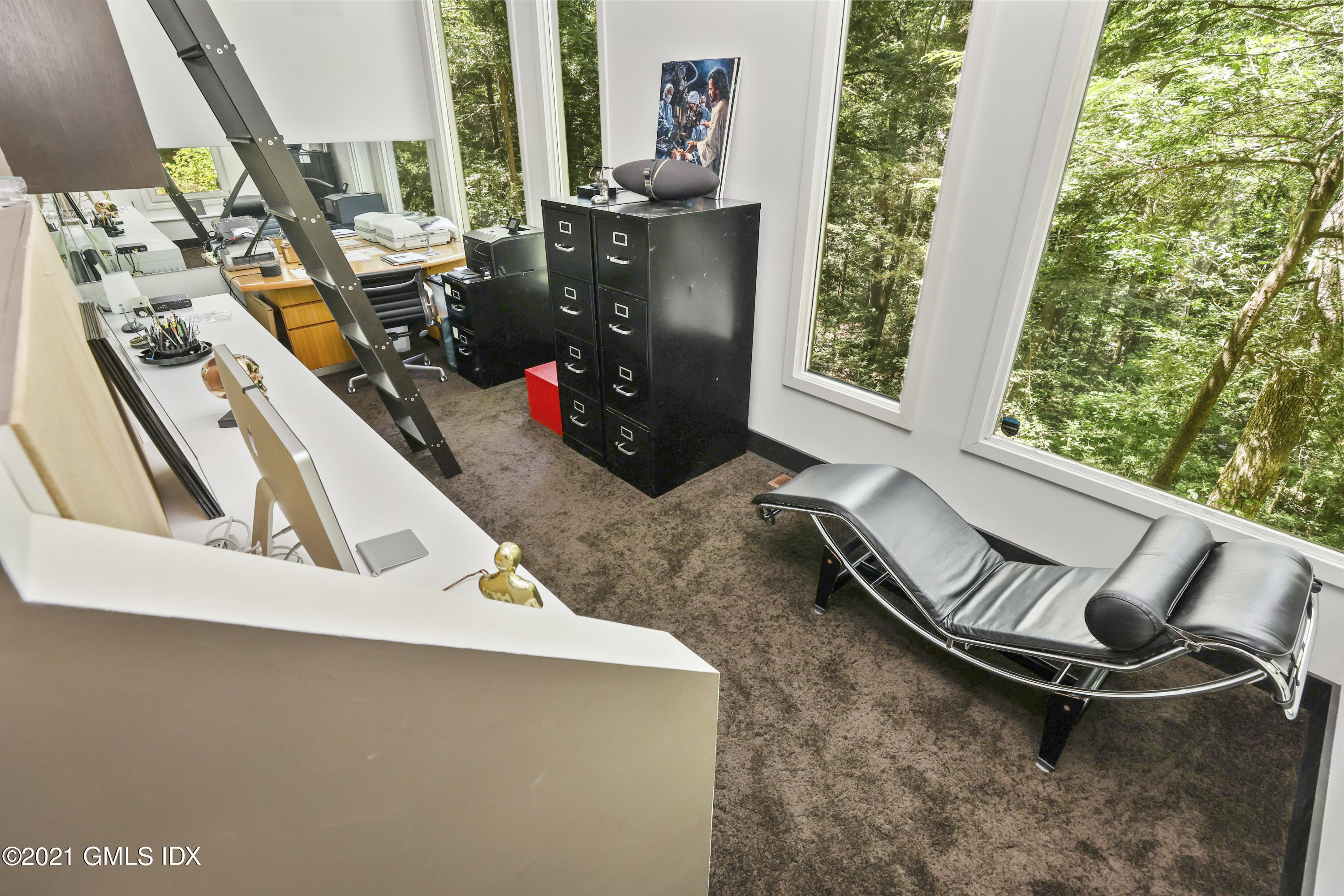 49 Mill Brook Road, Unit WEST Stamford, CT 06902 - Photo 13 of 37 a view of a living room with furniture and a floor to ceiling window