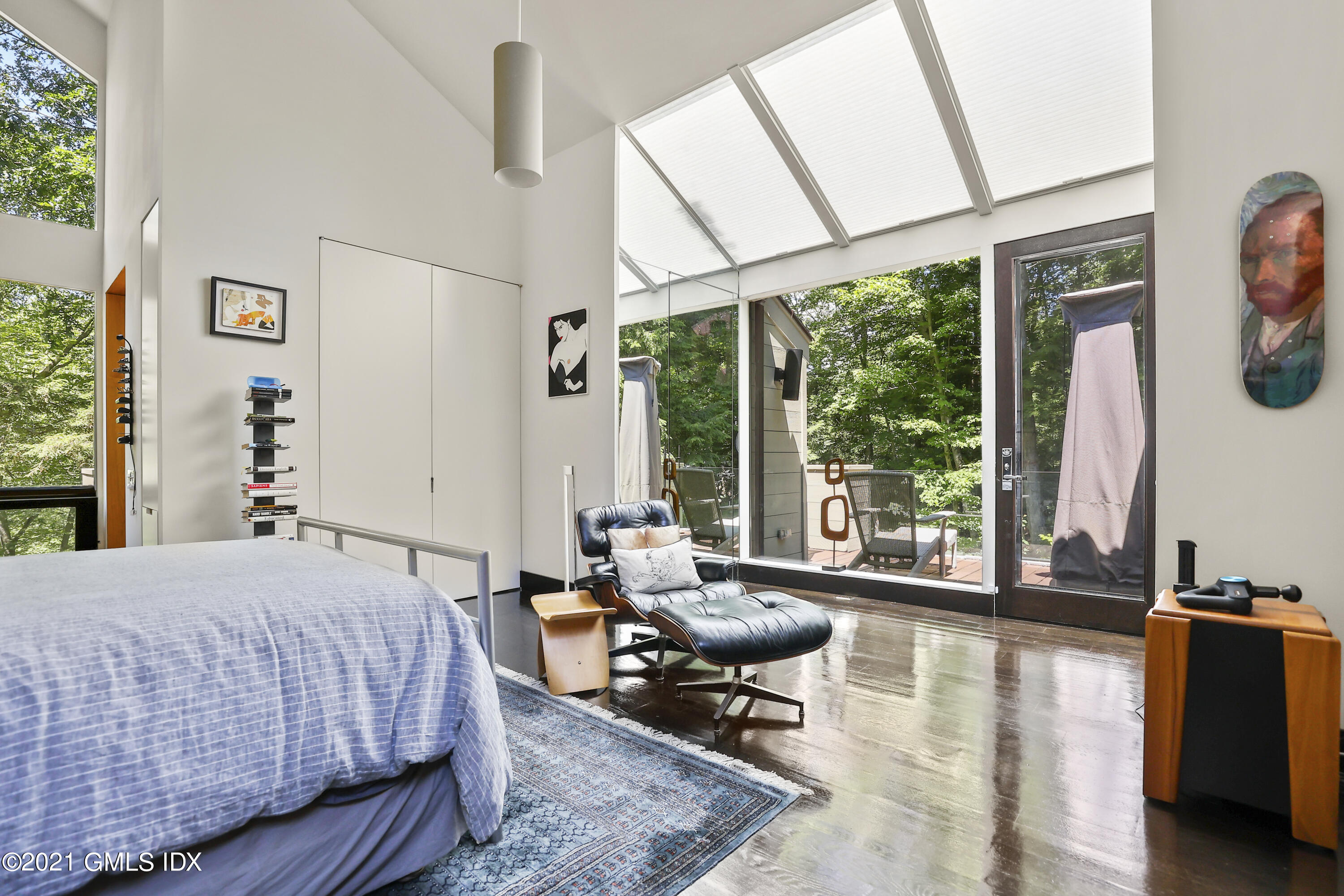 49 Mill Brook Road, Unit WEST Stamford, CT 06902 - Photo 15 of 37 a bedroom with a bed and large windows