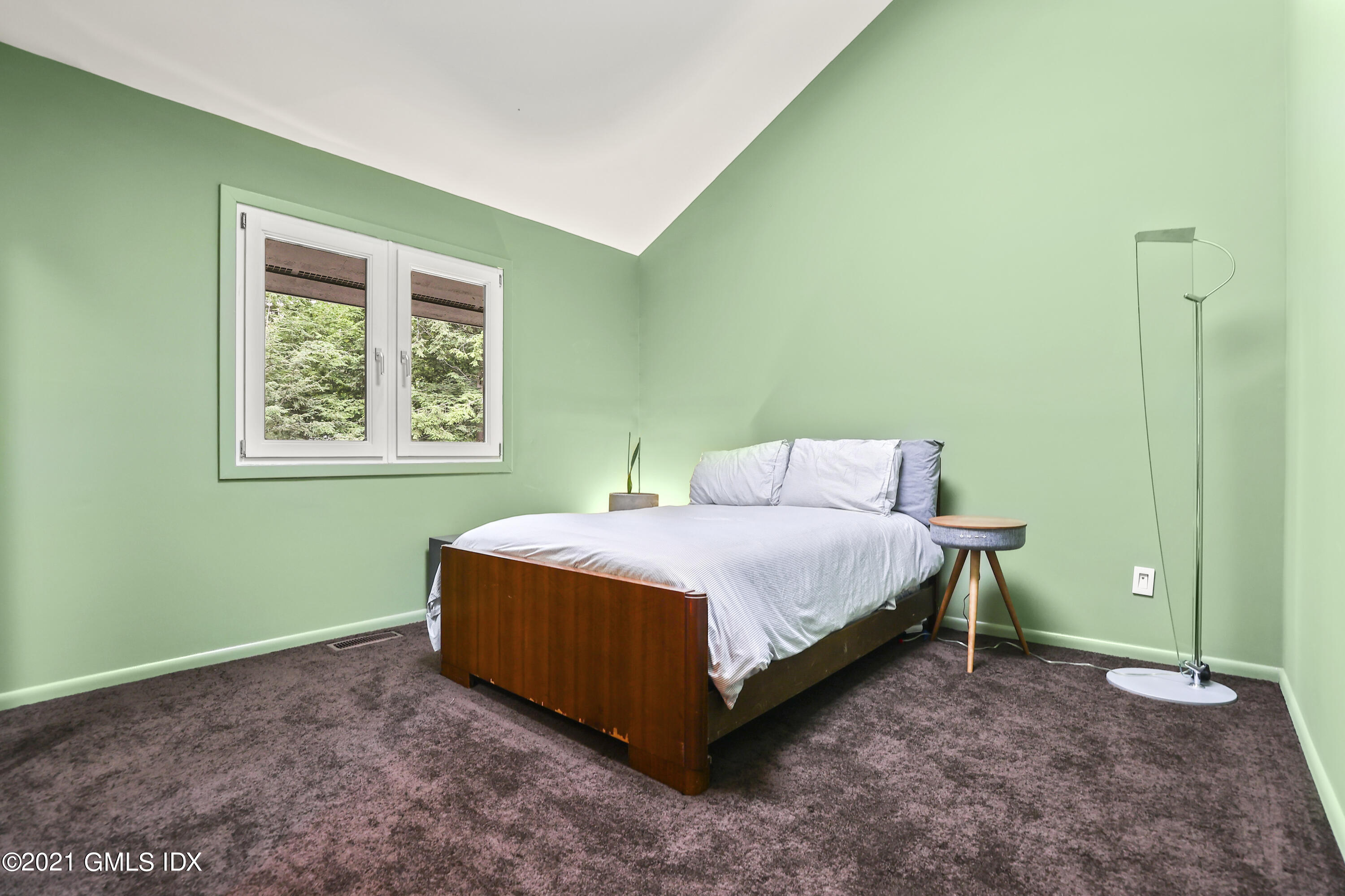 49 Mill Brook Road, Unit WEST Stamford, CT 06902 - Photo 23 of 37 a bedroom with a bed and a window