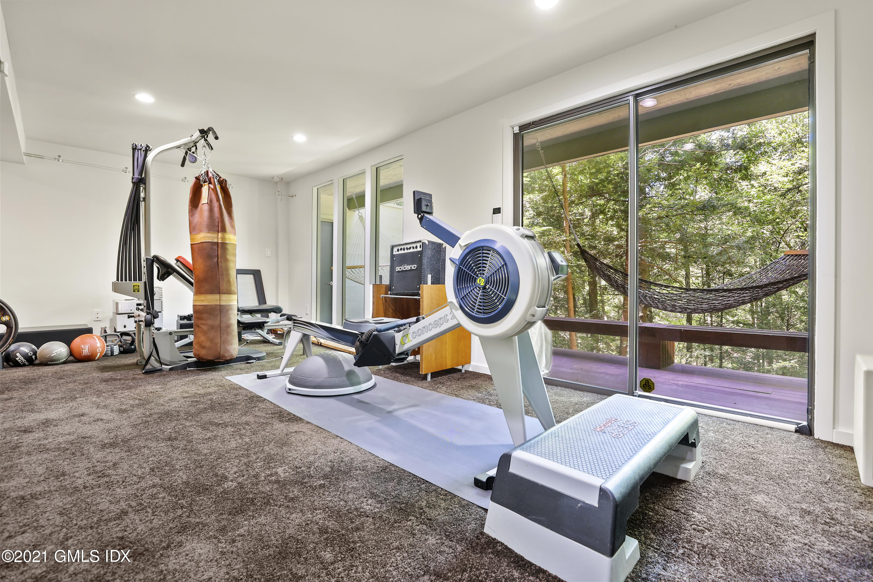 49 Mill Brook Road, Unit WEST Stamford, CT 06902 - Photo 25 of 37 a view of a room with gym equipment