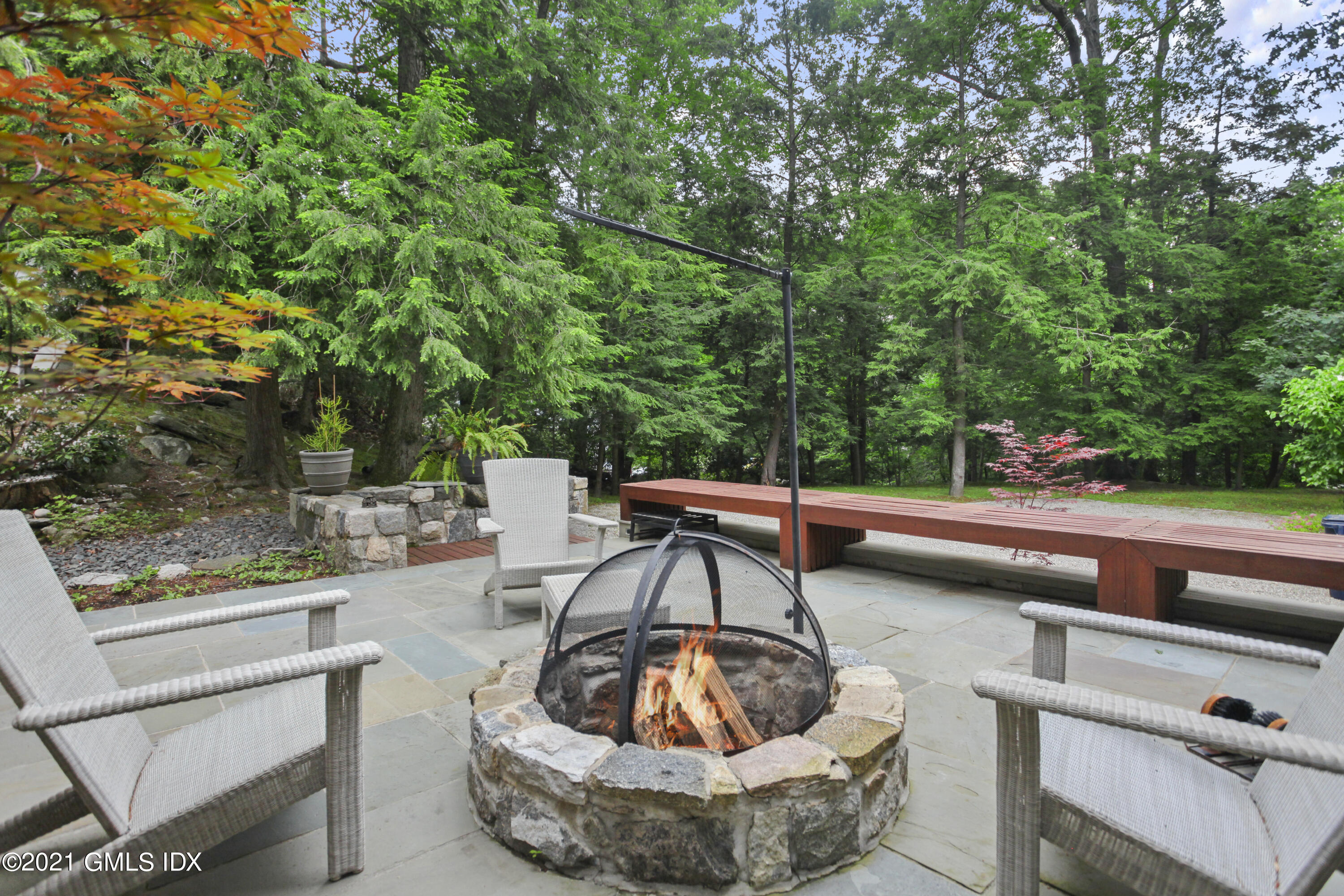 49 Mill Brook Road, Unit WEST Stamford, CT 06902 - Photo 28 of 37 a view of a swimming pool with a patio and a fire pit