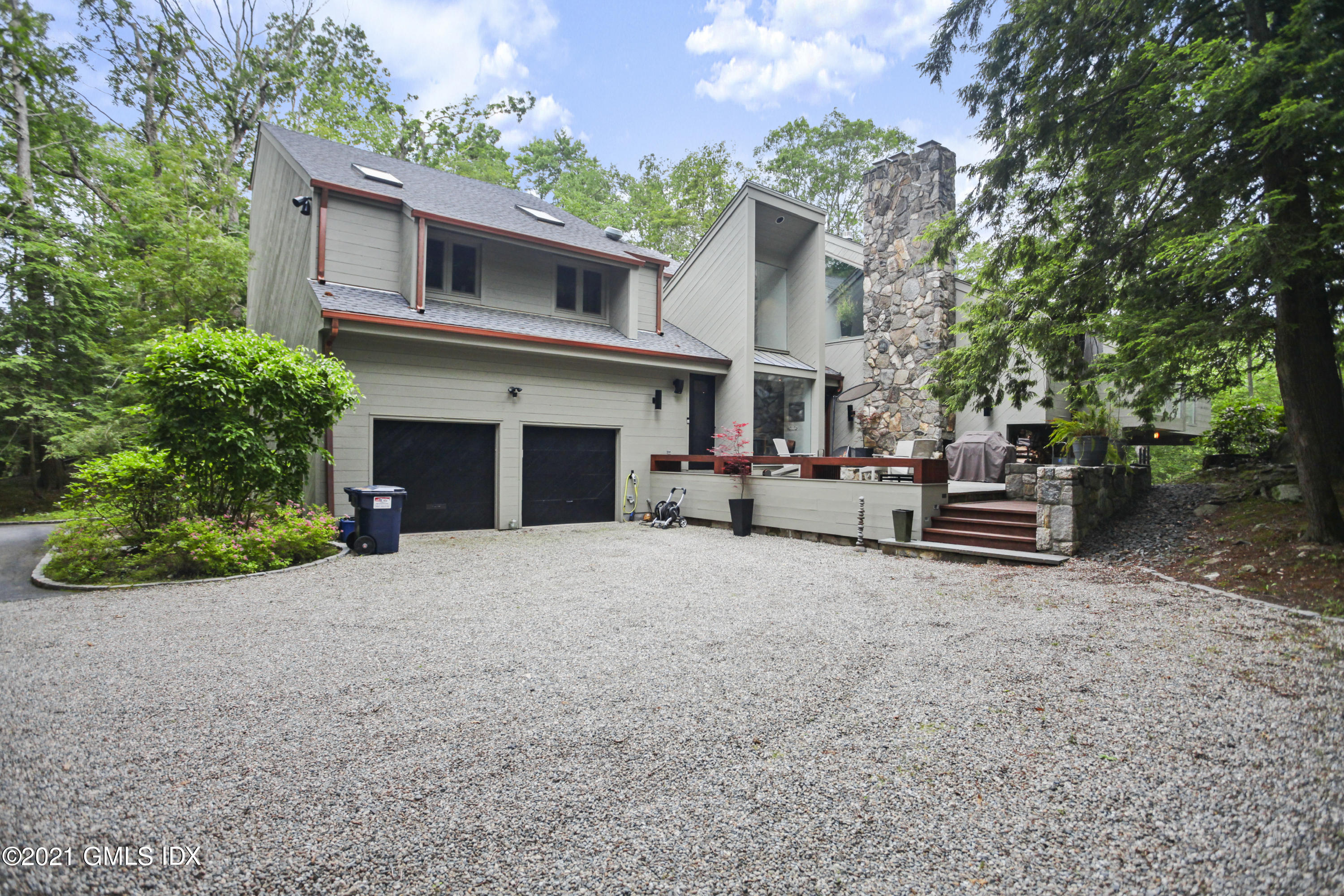 49 Mill Brook Road, Unit WEST Stamford, CT 06902 - Photo 34 of 37 a house view with a garden space