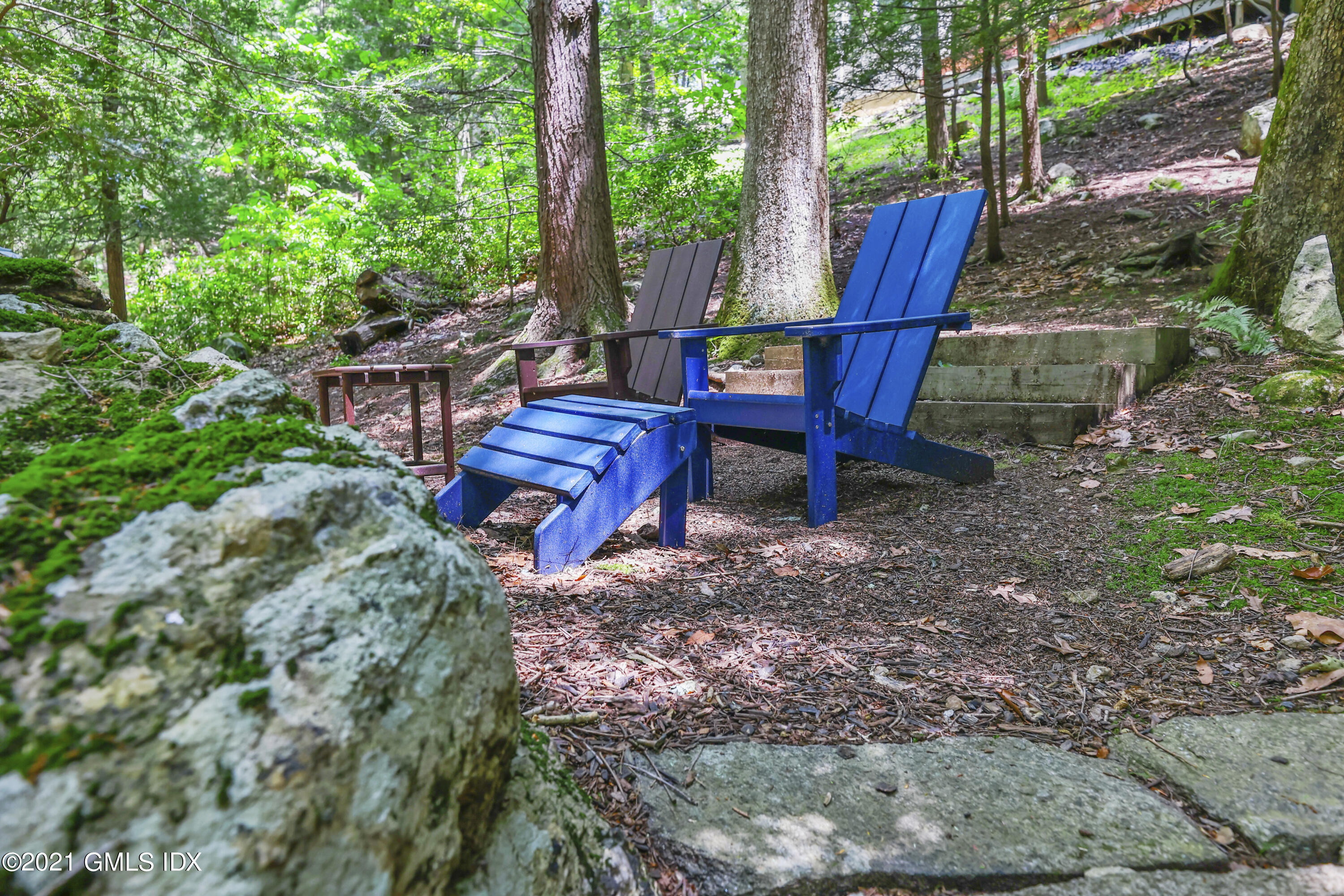 49 Mill Brook Road, Unit WEST Stamford, CT 06902 - Photo 35 of 37 a view of a yard with furniture and a backyard