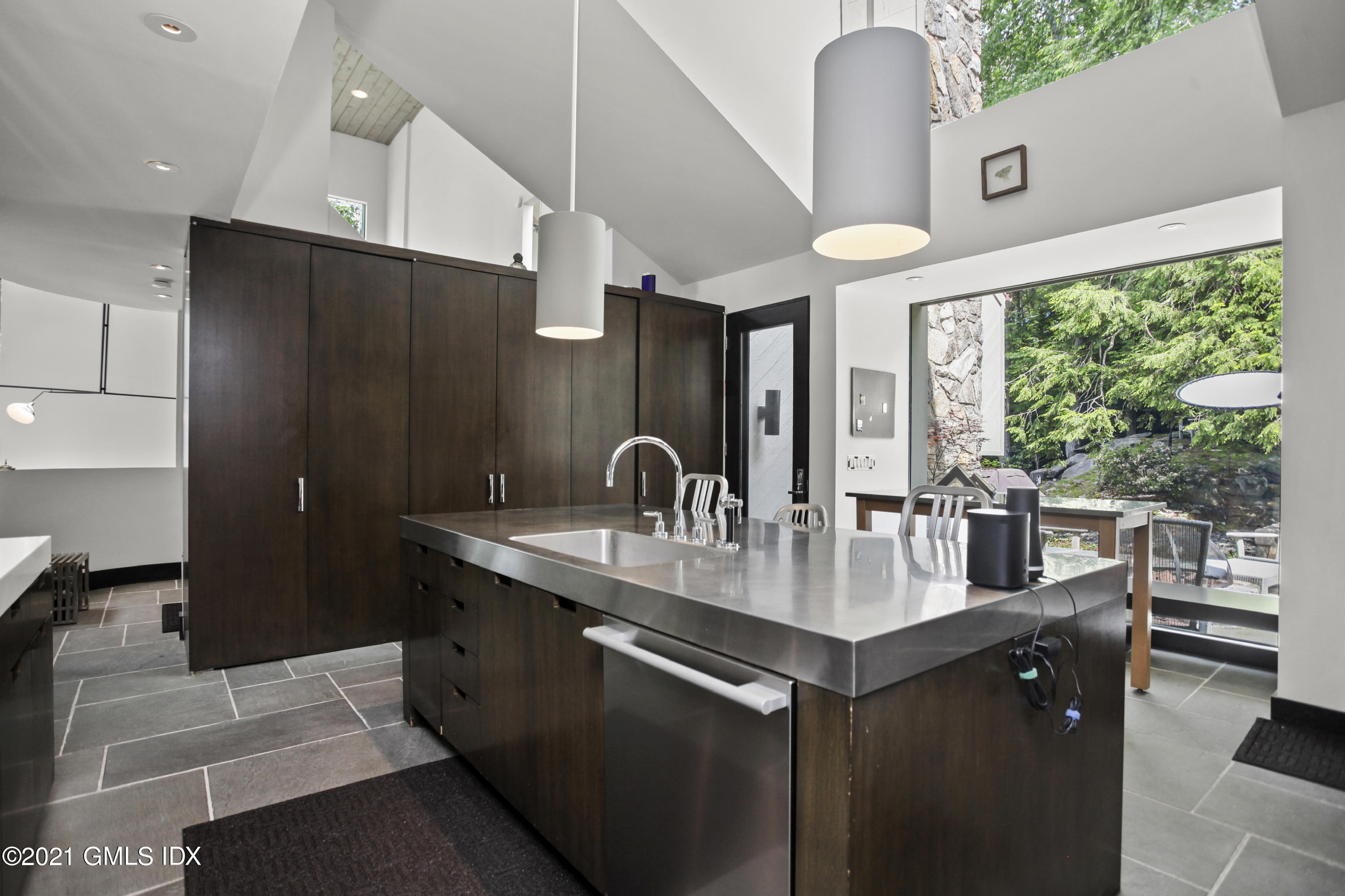 49 Mill Brook Road, Unit WEST Stamford, CT 06902 - Photo 8 of 37 a kitchen with stainless steel appliances granite countertop a sink a counter space and a refrigerator