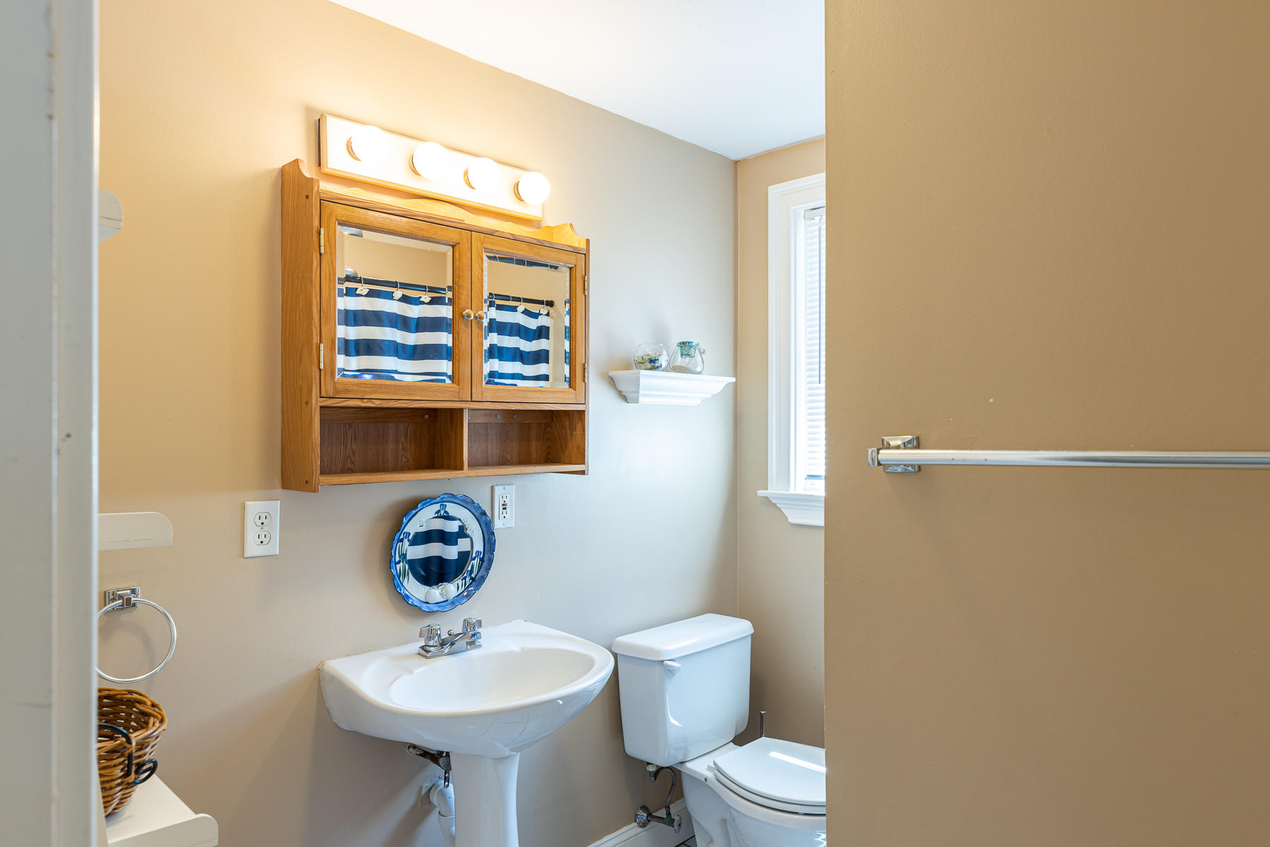 29 Hitching Post Lane Centerville, MA 02632 - Photo 17 of 29 a bathroom with a toilet a sink and a window