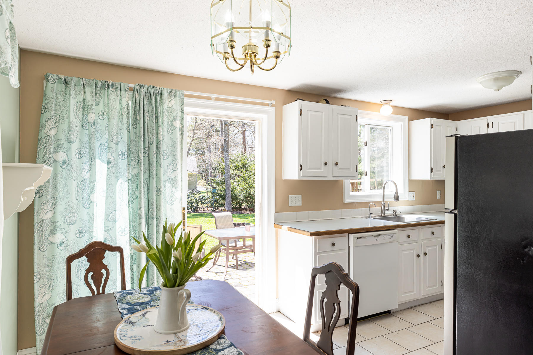 29 Hitching Post Lane Centerville, MA 02632 - Photo 5 of 29 a kitchen with a table and chairs