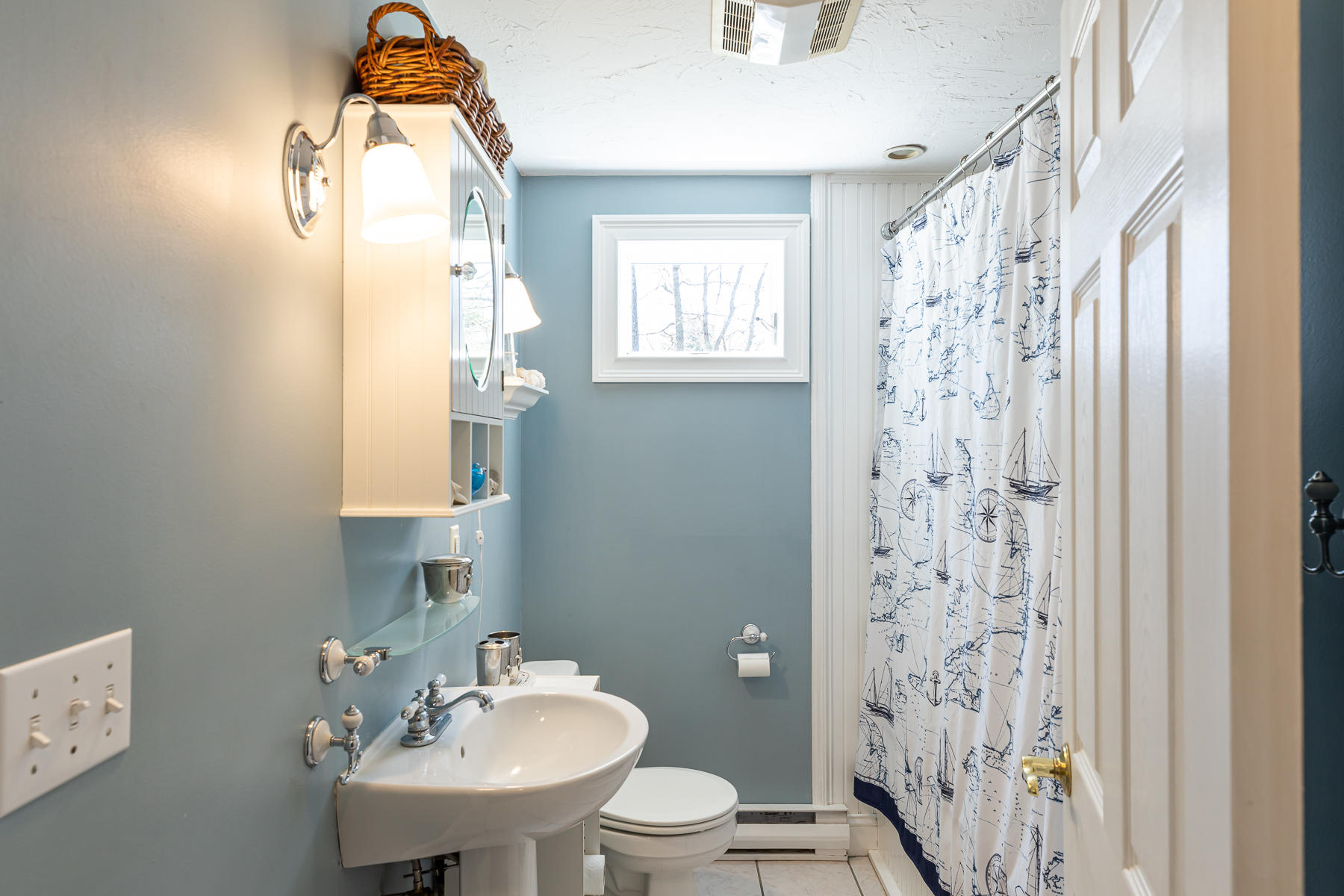 29 Hitching Post Lane Centerville, MA 02632 - Photo 9 of 29 a bathroom with a sink a toilet and a mirror